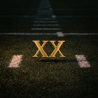 Jamal Roberts XX gold emblem on football field turf Flipside Hat Co NIL collection