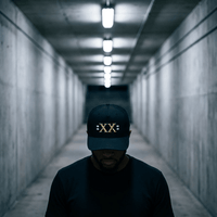 Jamal Roberts XX Midnight Slate trucker hat worn in industrial tunnel setting by Flipside Hat Co